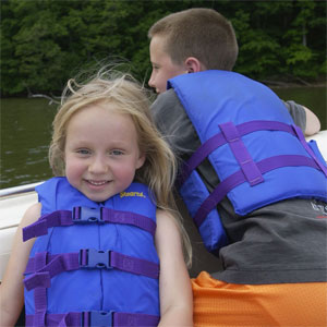 Kids on Boat Wearing Lifejackets