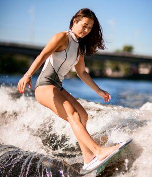 Young Girl Wakesurfing Without a Rope - How to Teach Kids to Wakesurf